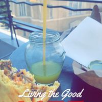 Chilling eating my food on balcony since all tables were full and the ones that weren’t didn’t have shade  at Vegan Beat in Athens