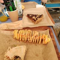 Chips / equivalent and end of a wrap we devoured too quickly! at Vegan Beat in Athens