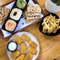 Trio of dips, fries and tofu nuggets  at Rhino Vegan Beat in Athens