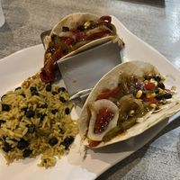 Server forgot my third taco. When he brought it out, it was slam packed with peppers and onions! 🤤  at Island Wing Company in Destin