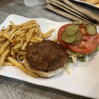 Classic burger with Beyond Meat and fries on gluten-free bun  at Island Wing Company in Destin