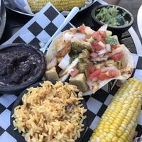 Crispy tofu and kimchi tacos with vegetarian refried black beans, rice, and corn at The Taco Joint in Hollywood