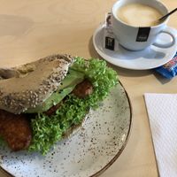 Dabbing Buddha bagel with vegan cappuccino at Olivia's Maastricht in Maastricht