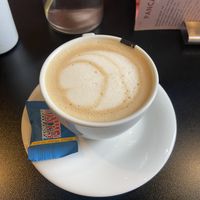 Cappuccino with oatmilk. Very thoughtful they placed a vegan Tony’s on the side!   at Olivia's Maastricht in Maastricht