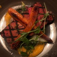 Beetroot marinated, grilled tofu with grilled carrots and orange-carrot pure at Zivago in Oulu