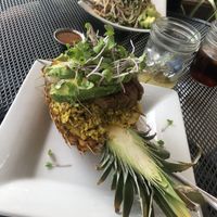Loco Moku served in a pineapple. Raw pad Thai in back  at Moku Roots in Kula
