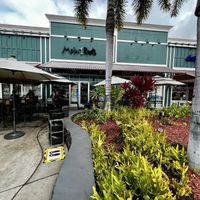 Outdoor seating with umbrellas  at Moku Roots in Kula