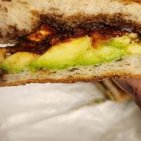 Full Vegan Panini with Avocado, Sundried Tomato, Onions with Balsamic Reduction when Split in Half at Carmine's Italian Deli in Elmsford