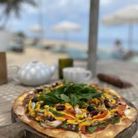 Vegan pizza with vegan cheese  at Genius Cafe in Sanur
