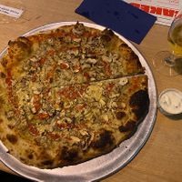 14 inch “shroom with a view” pizza with vegan garlic dip. Soooo good.   at Common - Nell's Pizza in Manchester