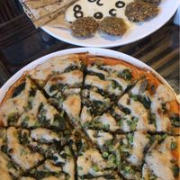 Vegan cheese pizza and Israeli plate  at Pumpernickel Bakery and Babylon Cafe in Pokhara