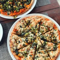 Cashew cheese pizza, loads of green veggies and a nice thick crispy base to hold it together at Pumpernickel Bakery and Babylon Cafe in Pokhara