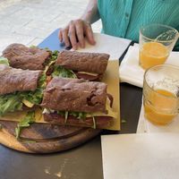 Two of their vegan sandwiches with fresh-squeezed orange juice   at Duecento Gradi in Rome