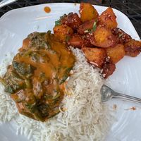I'm sorry this photo isn't better, but it shows the excellent coconut spinach with tofu and the chiya chili potatoes, both vegan. at Namaste Cafe in Minneapolis