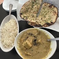 Eggplant curry, garlic naan  at Veggie Crust in Brookline