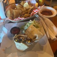 Vegan burrito and chips with salsa side  at CLT - Tequileria in Charlotte