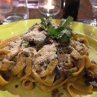 Turmeric tagliatelle with mushroom and vegan Parmesan, yes! at Ciriera Osteria Vegan in Trequanda