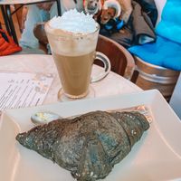 Croissant and coffee with cream at Dolce & Vegana in Madrid