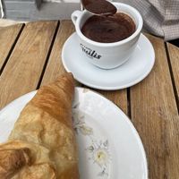 Hot chocolate and plain croissant   at Dolce & Vegana in Madrid