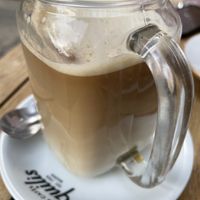 Oat milk large coffee  at Dolce & Vegana in Madrid