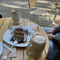 Cake and pumpkin spice latte  at Dolce & Vegana in Madrid
