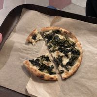 Plain oil and salt pizza with added spinach at Trieste Pizza in Rome