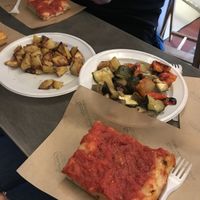 Tomato focaccia . Roast potatoes and roasted veg . All delicious  at Trieste Pizza in Rome