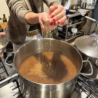 Squeezing the ginger juice out   at Solo in Lisbon