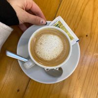 Oat milk frothy coffee  at Un Cafe in Valencia