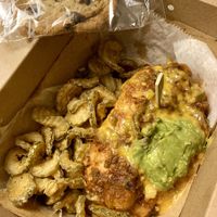 Delivery vegan chili cheese dog with fried pickles, added guacamole, and chocolate chip cookie  at The Dogfather in San Antonio