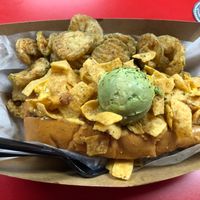 Vegan frito chili pie with fried pickles  at The Dogfather in San Antonio