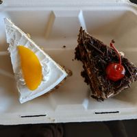 Vegan vanilla and peach cake, and black forest cake. Sooo good. at Donde Gopal in Quito