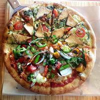 Half and half pizza. Top half is the spinach  and tofu one and the bottom one is the rockstar with okra and asparagus. at Gung Ho! Pizza in Beijing