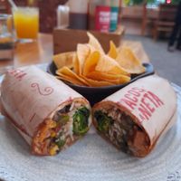 Vegan burrito with chips at Tacos La Neta in Panama City
