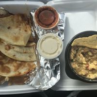 Chili-Lime Tofu w/cheese, grilled jalapeños, and onions quesadilla with a side of guacamole/chips.  at Archibowls in Lawrence