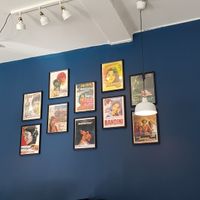 Pictures hanging on the wall that gives a pleasant atmosphere to the restaurant. at Dhaba in Vordingborg