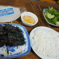 Veg-beed wrapped in herb and grilled, served with rice noodles, rice paper and sweet sour sauce at Tam An Lac - Dong Da District in Hanoi