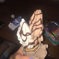 chocolate/ vanilla soft ice cream with chocolate sauce  at Attila Hildmann Organic Snackbar II in Berlin