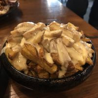 Pommes with a cheeze Sauce at Attila Hildmann Organic Snackbar II in Berlin