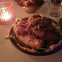 Dirty potatoes, black olive, aleppo pepper native greens, aioli at No Bones in Byron Bay