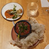 Stuffed Zucchini flowers on romesco and watermelon siviche with nori crisps  at No Bones in Byron Bay