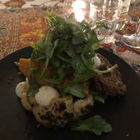 crumbed portobello mushrooms with roasted veggies on a bed of mashed potato at No Bones in Byron Bay