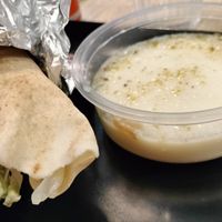 Pane arabo con hummus, falafel e insalata (il menù comprende anche patatine fritte o budino al latte, in foto, e una bibita a scelta) at Houmous & Co in Strasbourg