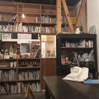Cafe counter, lots of books to peruse while waiting for food at Lounge Kado in Okayama
