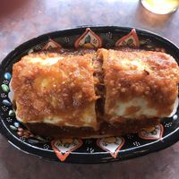 Sante Fe burrito with Beyond chicken strips “drowned” in red sauce (a green sauce option is also available.  at Baby Salsa Mexican Restaurant in Nanaimo