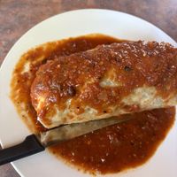 Burrito smothered in red salsa  at Baby Salsa Mexican Restaurant in Nanaimo