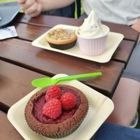 Chocolate pie with raspberries and gooseberry pie with soft serve ice cream at Glutenfria Paradiset in Ystad