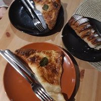 Possibly vegan khachapuri and cream filled pastry? at Purée Health Bar in Tallinn
