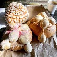 Vegan pan de muerto, vegan concha and cortado with oat milk   at Delicias Bakery in Los Angeles