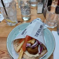 flatbread with humus, fries and zucchini fritters at The Real Greek - Old Spitalfields Market in East London